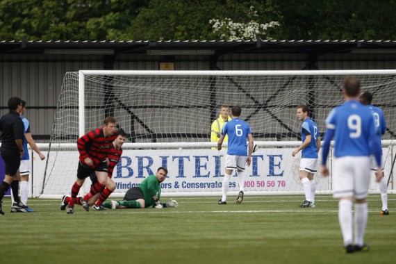 Kent FA Sunday Premier Cup Final between Simla (Blue) and Quested (Red).