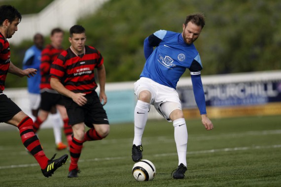 Kent FA Sunday Premier Cup Final between Simla (Blue) and Quested (Red).